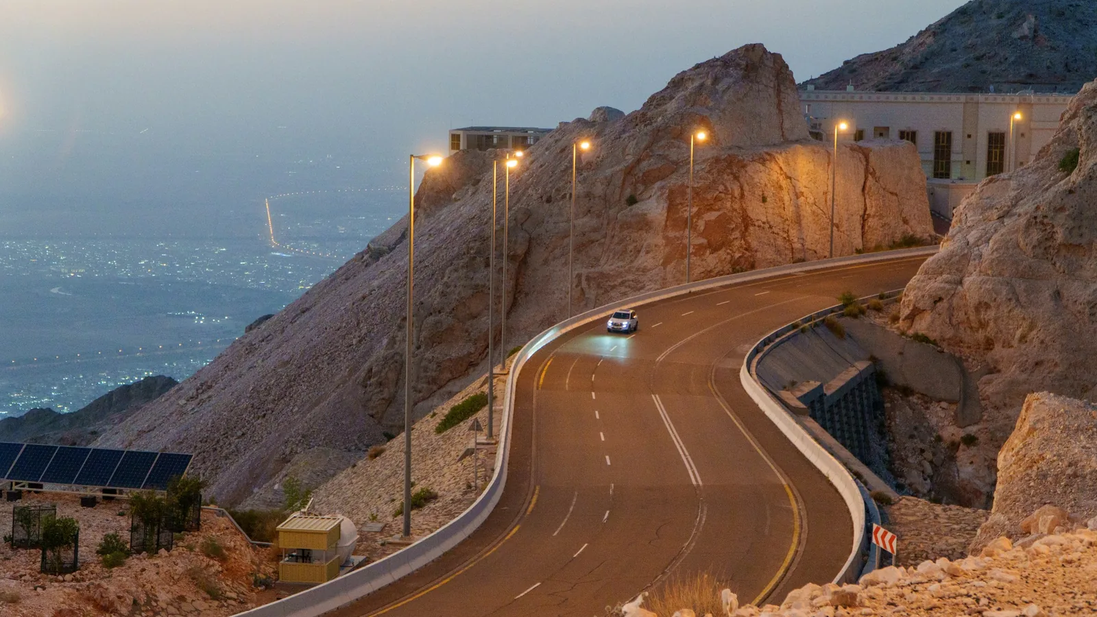 A car travelling on Jebel Hafeet mountain road in the United Arab Emirates